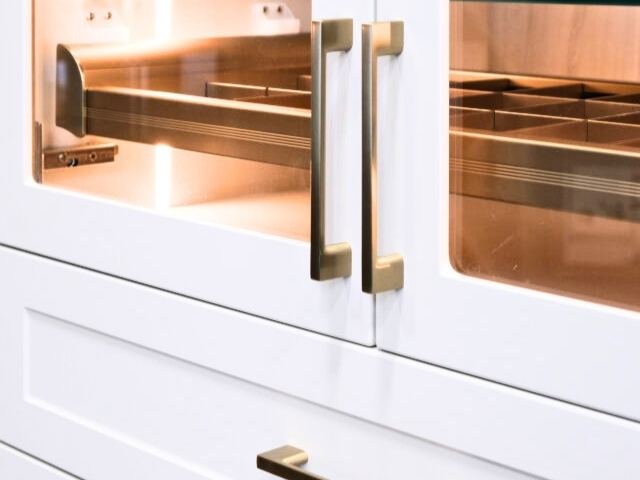 glass closet doors with gold vogue handles
