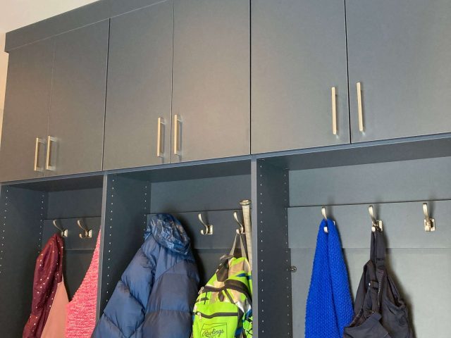 family mudroom with jackets hanging on locker room hooks