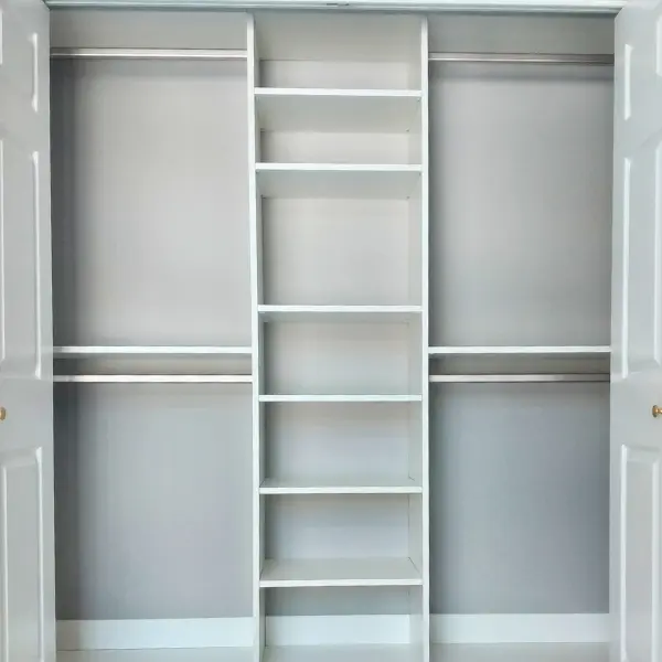 standard-closet standard white reach-in closet with shelves and double hanging sections.
